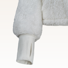 The Warrior Cropped Lounger is more than loungewear—it’s a lifestyle. I designed it in plush sherpa to be worn 24/7, 365 days a year, from couchside to courtside and everywhere in between. For me, it’s a true badge of comfort and strength—there for every moment I choose to thrive.&nbsp;Show here in White.


Product Details &amp; Care Instructions:

Fabrication: 100% Polyester, Sherpa
Features: Sherpa, Hood, Button Front-Closure, Rib Cuffs with Thumbholes
Fit: Relaxed Fit: Generously Cut with Maximum Wearing