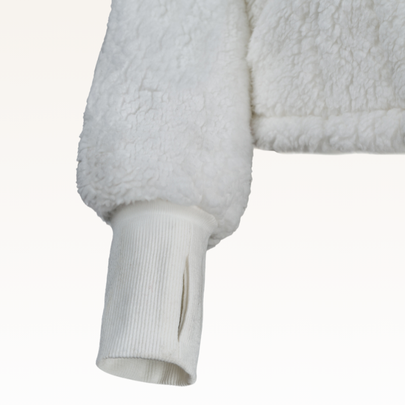 The Warrior Cropped Lounger is more than loungewear—it’s a lifestyle. I designed it in plush sherpa to be worn 24/7, 365 days a year, from couchside to courtside and everywhere in between. For me, it’s a true badge of comfort and strength—there for every moment I choose to thrive.&nbsp;Show here in White.


Product Details &amp; Care Instructions:

Fabrication: 100% Polyester, Sherpa
Features: Sherpa, Hood, Button Front-Closure, Rib Cuffs with Thumbholes
Fit: Relaxed Fit: Generously Cut with Maximum Wearing