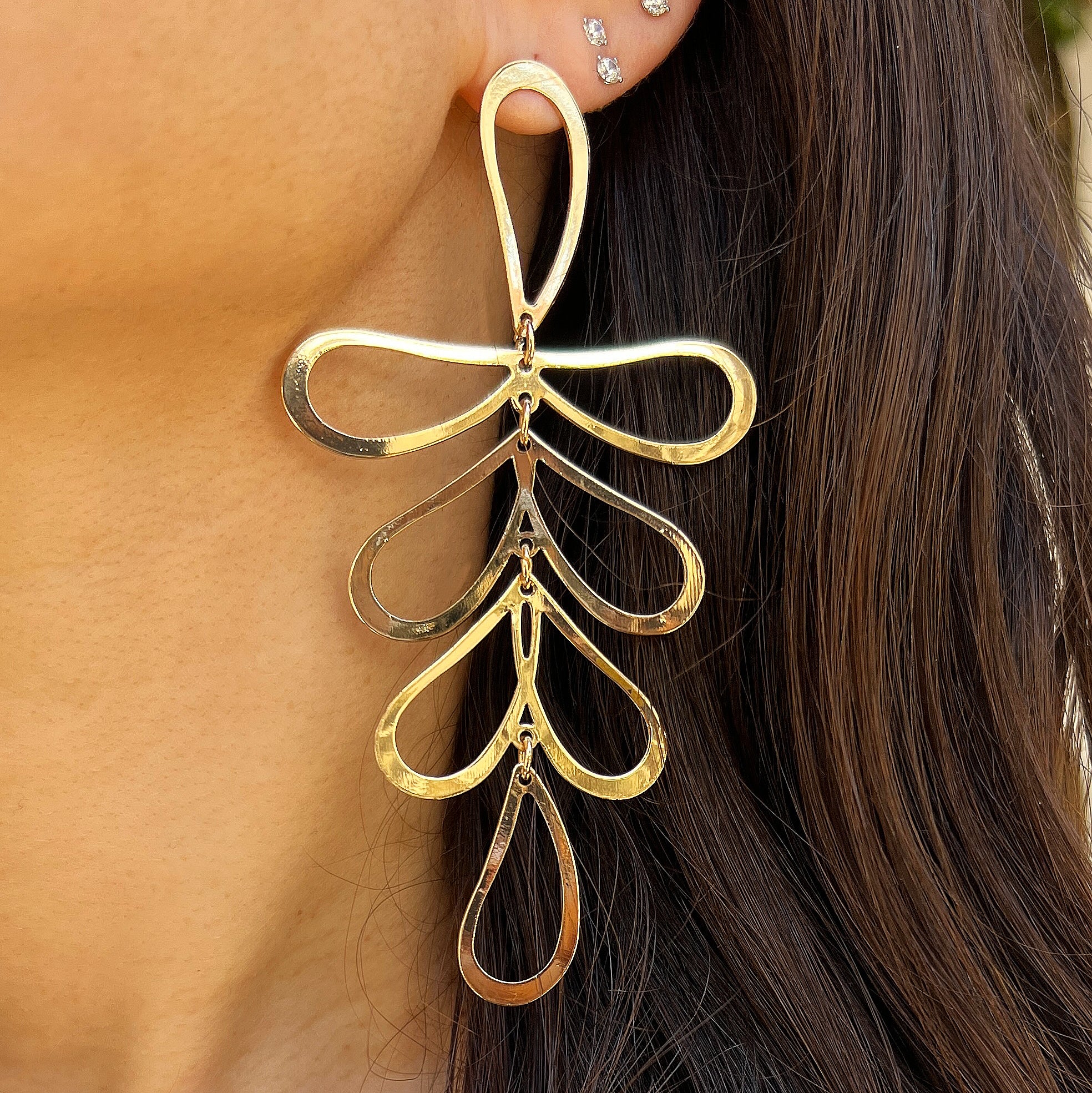 Open Leaf Pierced Earrings

Add a touch of playful to your look with our Open Leaf Earrings! These unique and delicate earrings feature a charming leaf design, perfect for any outfit. Embrace your playful side with a chic twist on a classic statement earring.

Yellow Gold Plated
4.26" Long X 2.20" Wide