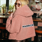 The Warrior Cropped Lounger is more than loungewear—it’s a lifestyle. I designed it in plush sherpa to be worn 24/7, 365 days a year, from couchside to courtside and everywhere in between. For me, it’s a true badge of comfort and strength—there for every moment I choose to thrive.&nbsp;Show here in Romantic Rose.


Product Details &amp; Care Instructions:

Fabrication: 100% Polyester, Sherpa
Features: Sherpa, Hood, Button Front-Closure, Rib Cuffs with Thumbholes
Fit: Relaxed Fit: Generously Cut with Maximum