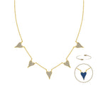 Gold-tone necklace with five pavé-set heart-shaped pendants, shown on a white background with a circular inset highlighting reversible  blue color.
