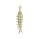 A gold fish-shaped charm pendant with a textured scale pattern, a small dark blue eye, and a lobster clasp at the top, shown on a plain white background.