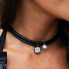 Asscher CZ Black Leather Cord Choker Necklace

Elevate your style with this sophisticated leather cord choker necklace. Its sleek design offers a unique, on-trend accessory that complements both casual and elegant outfits, adding a subtle edge to your look. Perfect for those who appreciate minimalist yet distinctive jewelry.

White, Yellow &amp; Oxidized Plating Over Silver
Bail: 14K Yellow Gold
Asscher CZ: 12MM Stone
13-15" Adjustable Length