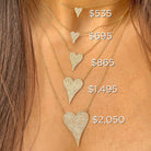 Heart-shaped diamond necklaces with varying prices displayed on a person's neck.