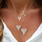 Medium Sized Pave Diamond Heart Necklace

Sparkle up your style with our Medium Diamond Heart Necklace! This staple piece features shimmering diamonds on a classic heart pendant, perfect for adding a touch of elegance to any outfit. A must-have for any jewelry collection!

14K Yellow Gold
0.26 Diamond Carat Weight
15.5"- 17.5" Chain Length
Heart: 0.66" Length X 0.44" Width

Shop all sizes &amp; colors of this necklace here.