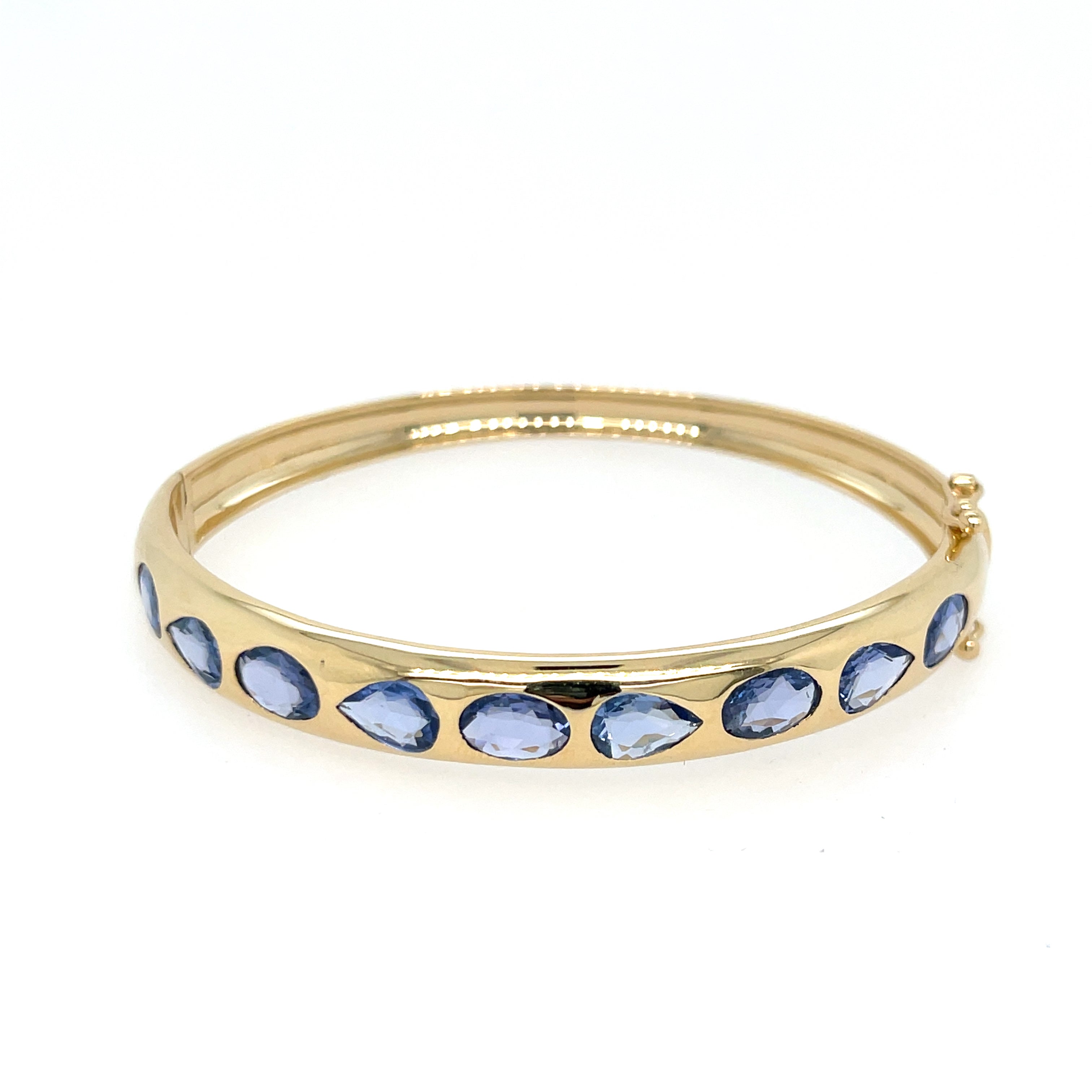 Teardrop & Oval Blue Sapphire Bangle Bracelet

With a bold silhouette and rich color, this bangle dares to stand out! Its striking design features a pattern of teardrop and oval blue sapphires that shimmer with every movement. Set in sleek yellow gold, it's the perfect accessory for making a statement. Wear it solo or stack it for an even bolder look.

14K Yellow Gold
0.30" Thick
14.15 Blue Sapphire Carat Weight