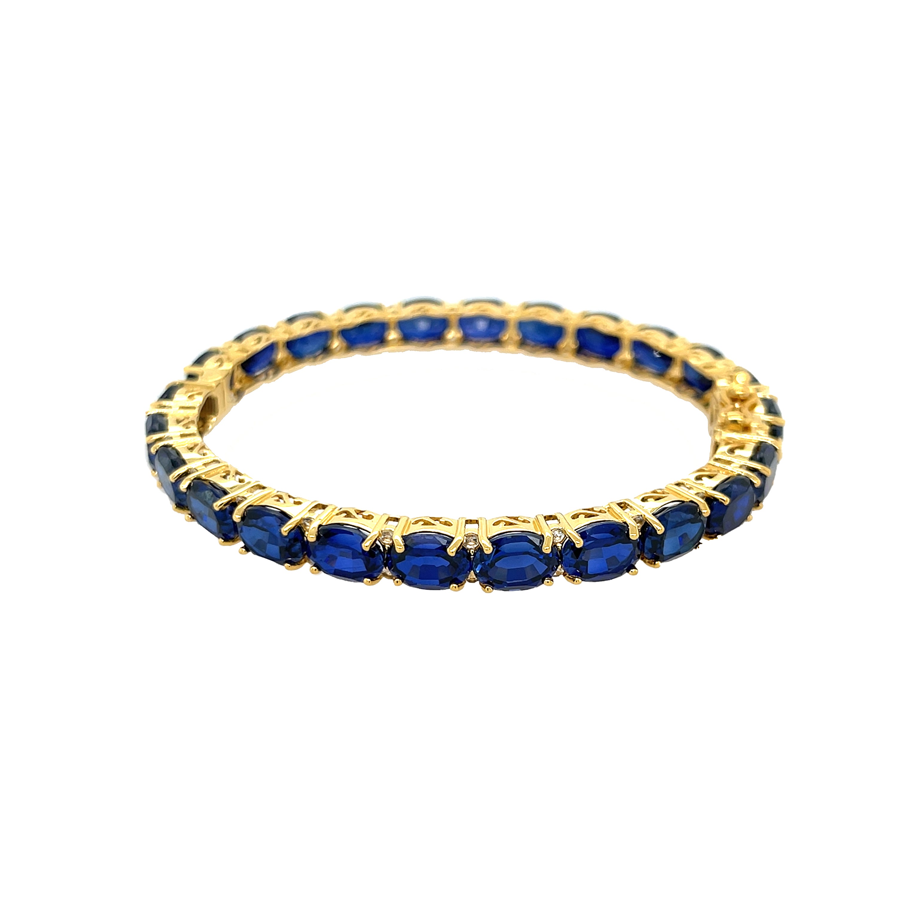 Oval Blue Sapphire &amp; White Topaz Tennis Bangle Bracelet

Yellow Gold Plated Over Silver&nbsp;
Lab Blue Sapphire
0.23" Wide