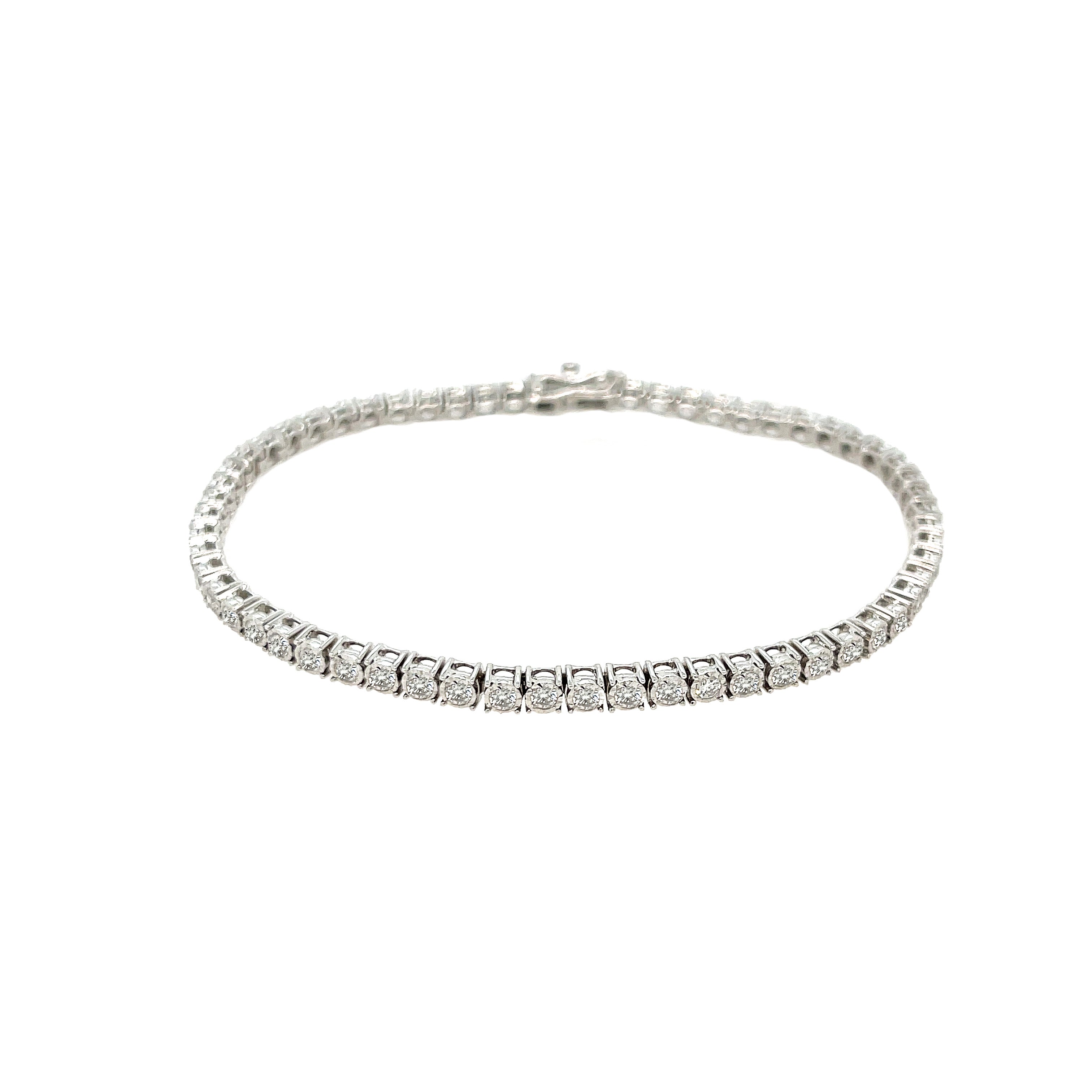 Diamond Tennis Bracelet

Indulge in the timeless elegance of our Diamond Tennis Bracelet. Crafted with sparkling diamonds, this versatile piece is the perfect staple for any outfit. Elevate your style with this luxurious addition to your jewelry collection.

14K White Gold
2 Carat Diamond Weight
7" Length