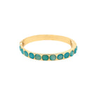 <p>Aqua Round Stone Bangle Bracelet</p> <ul> <li>Yellow Gold Plated</li> <li>0.29" Wide</li> </ul>