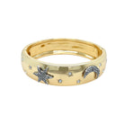 CZ Star &amp; Moon Bangle Bracelet

Add a touch of fun and whimsy to any outfit with our Star &amp; Moon Bangle Bracelet. The playful design will add a unique charm to your style. The bangle design makes it easy to slip on and off, perfect for any occasion.

Yellow Gold Plated
0.62" Wide