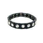 Black bracelet with embedded crystals on a white background