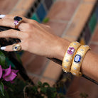 Pink Sapphire &amp; White Topaz Bangle Bracelet

Yellow Gold Plated Over Silver&nbsp;
Cushion Cut Lab Pink Sapphire
0.76" Wide