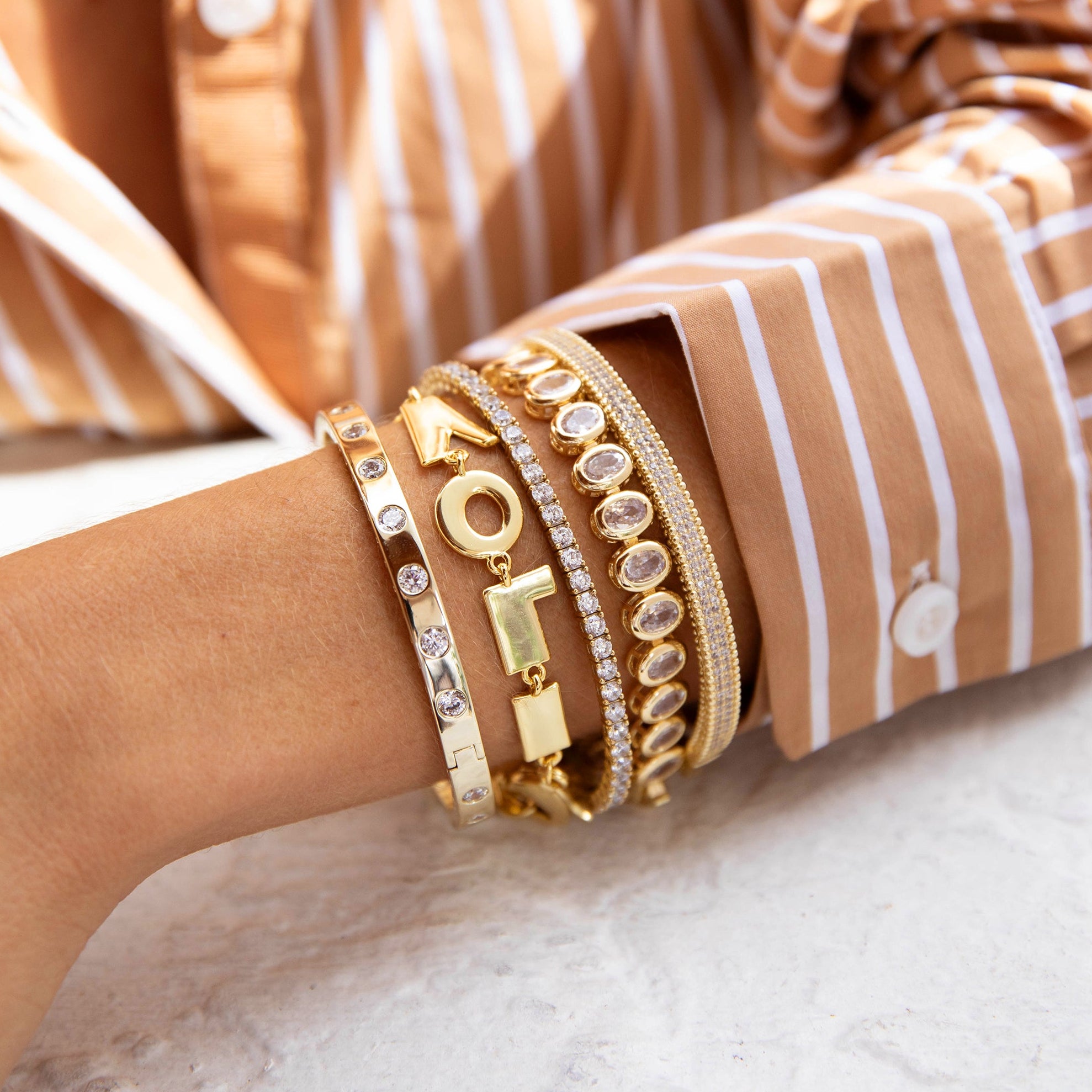 Textured Thin Cuff Bangle Bracelet

Accessorize in style with our Textured Thin Bangle Bracelet. The crystals on this bangle are channel-set for a smooth, elegant design. Perfect for a touch of glam on any occasion!

Yellow Gold Plated
Matte Finish
Cubic Zirconia
0.20" Wide