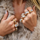 Three Cushion Stone Gypsy Ring

Indulge in luxurious elegance with our Triple Stone Gypsy Ring. Featuring three stunning cushion stones, this ring exudes a sophisticated style that will elevate any outfit. Crafted by Jennifer Miller, this ring is a must-have for those who appreciate the finer things in life.

14K Yellow Gold
0.5" Width X 0.3" Height
Cubic Zirconia

For additional sizes, first place your order then email us your size to &nbsp;websales@jennifermillerjewelry.com