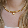 Beaded Heart Choker Necklace  Yellow Gold Plated 7-13" Adjustable Length 8mm Beads Heart Charm: 0.54" Long X 0.63" Wide    While supplies last. All Deals Of The Day sales are FINAL SALE.