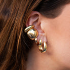 Plain Thick Cuff Earring

Elevate your ear stack with this Thick Cuff Earring, designed to add bold sophistication without the need for piercings. Its chunky silhouette creates a striking statement, perfect for layering or wearing alone to enhance your look with modern elegance.

Yellow Gold Plated
0.85" Long x 0.21" Wide