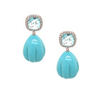 Turquoise earrings with gemstones on a white background
