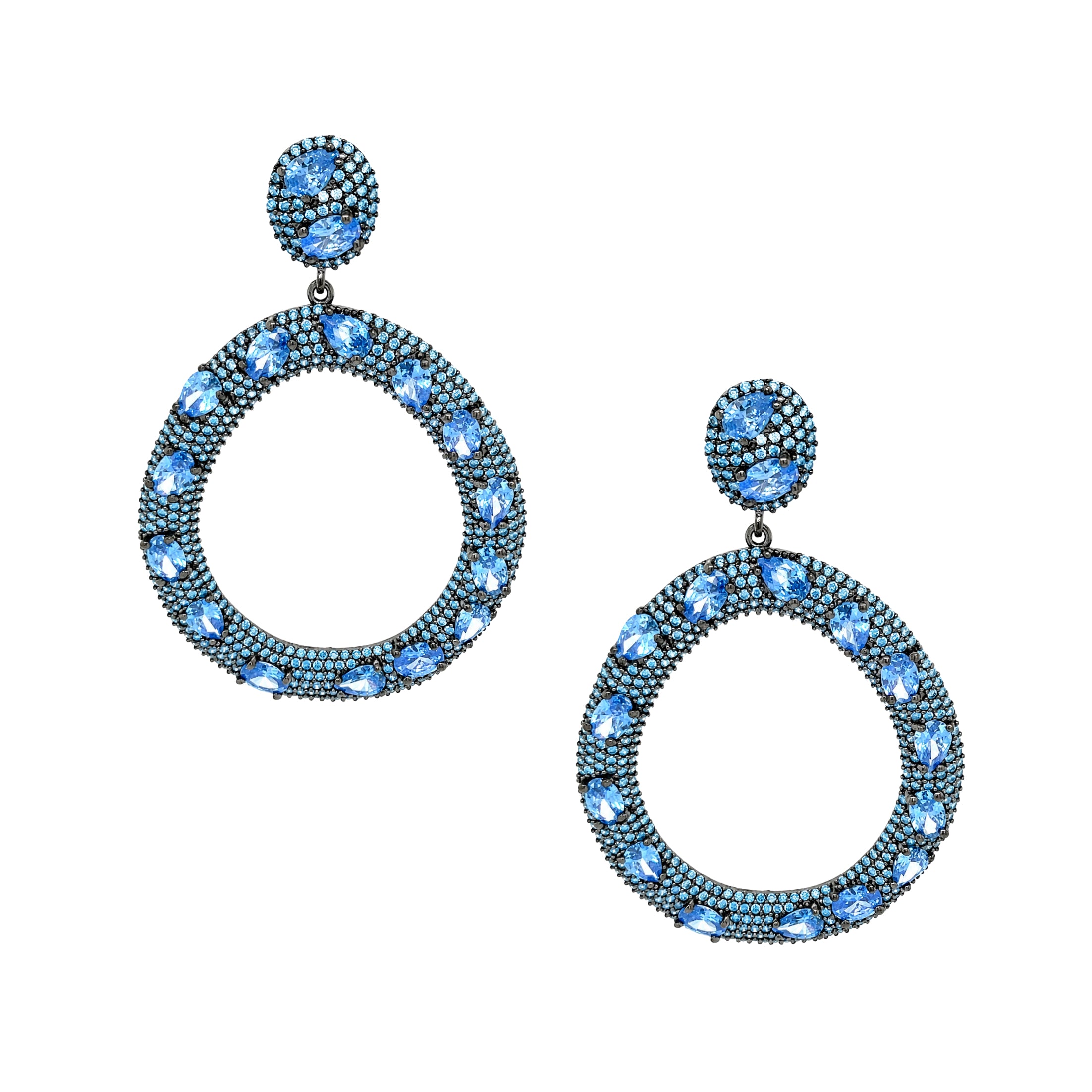 Blue Open Circle Pierced Earrings

Defined by deep blue and aqua crystals, these open circle drop earrings offer a refined balance of color and brilliance. Elegant yet striking, they are designed to elevate every look with effortless sophistication.

Oxidized Gold Plated Over Silver
2.50" Long X 1.75" Wide
Cubic Zirconia