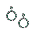 These open circle pierced earrings feature vibrant pink crystals that add a bold, playful pop of color. Lightweight and easy to wear, they bring instant glamour to any look, day or night.