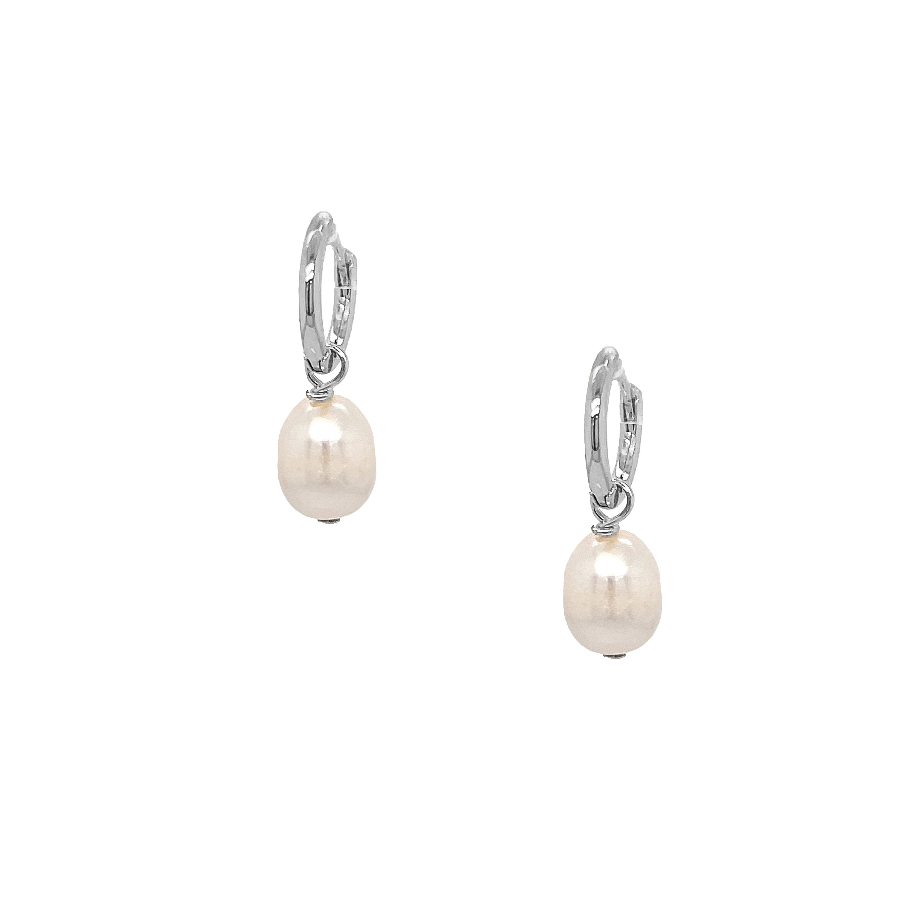 Pair of pearl earrings with silver hooks on a white background