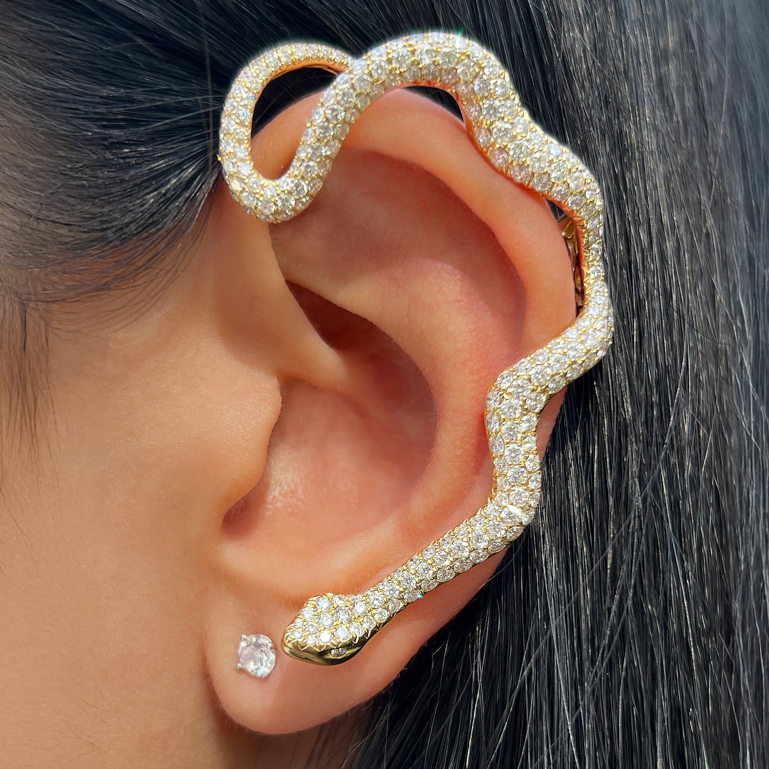 Diamond Snake Ear Cuff Earring

Sculptural snake-inspired ear cuff plated in 18K yellow gold and set with diamonds. Designed to hug the ear with a fluid, wraparound silhouette, this statement cuff adds bold sparkle with no piercing required. Wear solo or stack with studs and hoops for an elevated edge.

18K Yellow Gold
3.17 Diamond Carat Weight


Fits on left ear only.