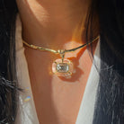 Sculpted Clear Lucite Charm Choker Necklace

A modern statement necklace designed with sculptural simplicity in mind. Finished in a polished 14K yellow gold plating, this open choker features a fluid, organic silhouette accented with a single faceted lucite charm. The structured yet lightweight design sits comfortably along the neckline, adding subtle shine with a refined edge.&nbsp;

14K Yellow Gold Plated
1.28" Long X 0.98" Wide