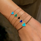 Pave Diamond &amp; Turquoise Heart Chain Bracelet

This delicate gold chain bracelet features a turquoise heart, framed with a hint of pave diamond sparkle. Fresh and feminine, it adds a soft pop of color, perfect worn alone or stacked with your favorite gold bracelets

14K Yellow Gold
0.08 Diamond Carat Weight
0.48 Turquoise Carat Weight
Heart: 0.40" Width
Chain: 6-7"&nbsp;Length