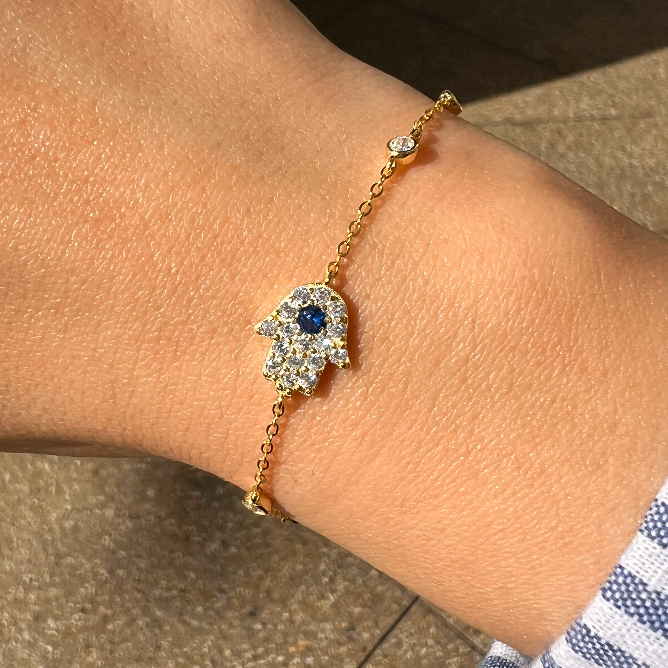 CZ Hamsa &amp; Bezel Bracelet

Yellow Gold Plated Over Silver
Hamsa: 0.42" Long
6-7.5" Adjustable Length

While supplies last. All Deals Of The Day sales are FINAL SALE.