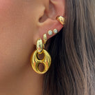 Mariner Link Drop Hoop Earrings

Elevate your everyday style with these statement earrings. Featuring a chic gold plated hoop and an oversized mariner link drop, this contemporary design balances bold proportions with smooth, sculptural curves. Effortlessly versatile, they bring a touch of sophistication to everything from casual daytime outfits to evening ensembles.

Yellow Gold Plated

1.6" Long 0.9" Wide