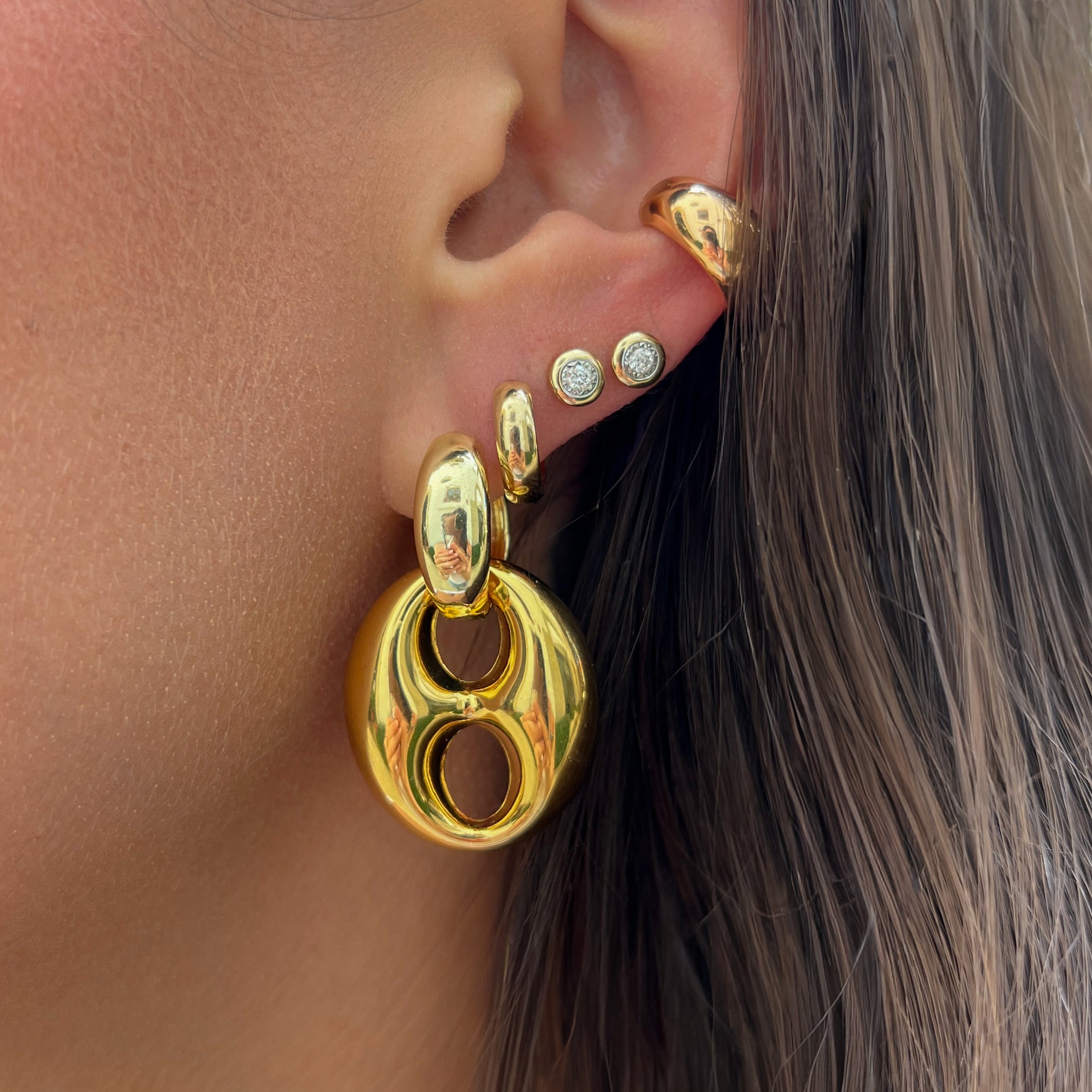 Mariner Link Drop Hoop Earrings

Elevate your everyday style with these statement earrings. Featuring a chic gold plated hoop and an oversized mariner link drop, this contemporary design balances bold proportions with smooth, sculptural curves. Effortlessly versatile, they bring a touch of sophistication to everything from casual daytime outfits to evening ensembles.

Yellow Gold Plated

1.6" Long 0.9" Wide