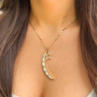 Enamel Moon &amp; Star Charm Necklace

Add a touch of celestial charm with our Moon &amp; Star Charm Necklace. Featuring enamel moons and stars, this playful necklace is sure to make a statement. Perfect for everyday wear or a night out under the stars.

Yellow Gold Plated
Moon: 2" Long X 0.25" Wide
Star: 0.75" Long X 0.5" Wide
17-19" Adjustable Length
Cubic Zirconia