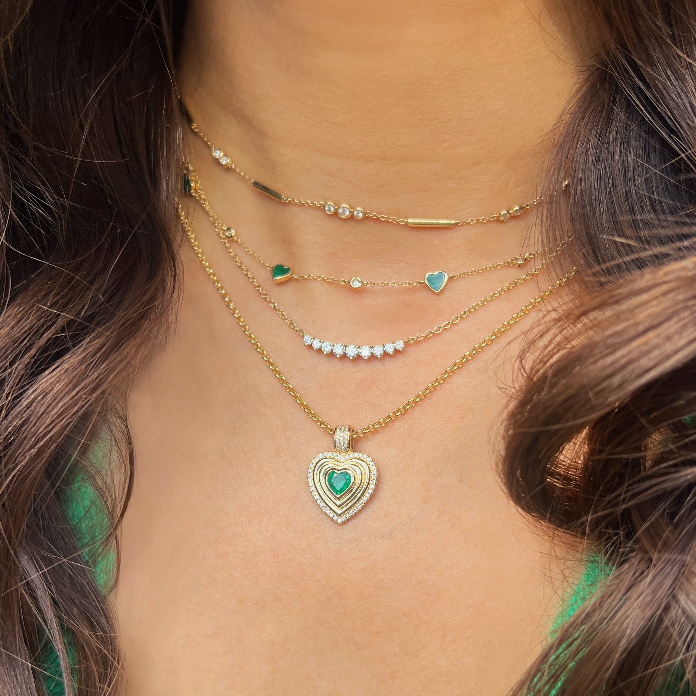 Diamond &amp; Emerald Heart Necklace

14K Yellow Gold
0.19 Diamond Carat Weight
0.41 Emerald Carat Weight
Heart: 0.82" Long x 0.59" Wide
16-18" Adjustable Length