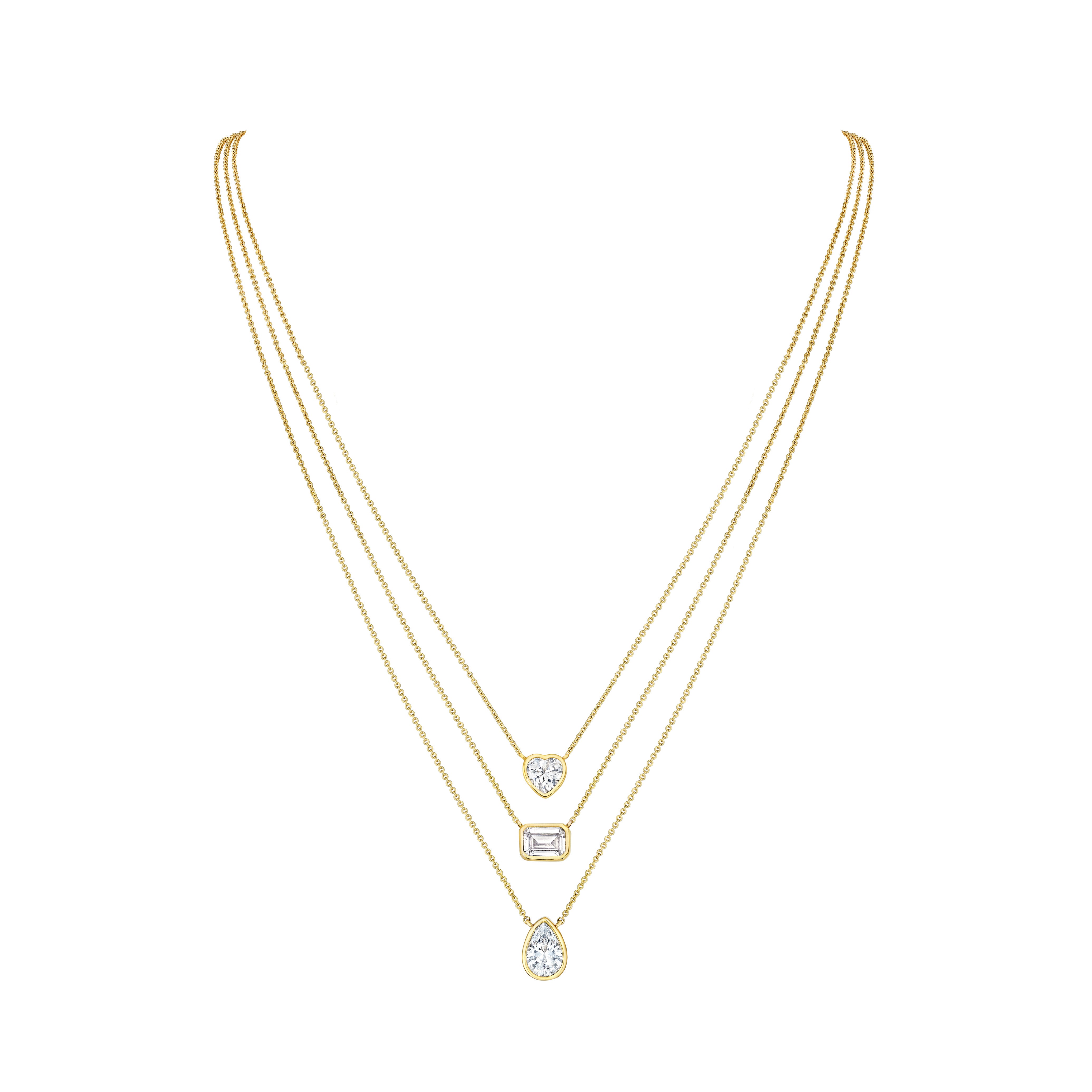 Triple Strand CZ Layered Necklace  14K Yellow or White Gold Plated  Can be worn 16 to 22 inches, Adjustable  3 Bezel-set high intensity CZ stones  Heart Shaped CZ approximately 1 CT  Center Emerald Cut CZ approximately 1 CT Pear Shape CZ approximately 1.25 CT 3 Strand 1mm Cable Link Chain with Lobster Clasp