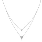 Two heart-shaped pendants on a silver chain against a white background

Layered Double Heart Necklace

White Gold Plated
Small Heart: 0.38" Long X 0.38" Wide
Large Heart: 0.50" Long X 0.63" Wide
16-20" Long
Faux Pave Diamond