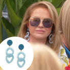 Blue Medium Resin Chain Clip On Earrings&nbsp;

Yellow Gold Plated
&nbsp;3.25" Length X 1.25" Width

As seen on&nbsp; Kathy Hilton in Real Housewives of Beverly Hills.