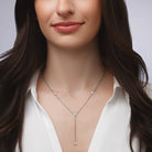 Bezel Set Lariat Necklace  14K Yellow or White Gold Plated Can be worn 17 to 21 inches, Adjustable Round CZs approximately 0.15 ct each  Center Pear CZ approximately 0.35 ct Lariat drop is 2 inches long