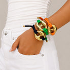 Adjustable Gold Mariner Link Bracelet

Bright, playful, and endlessly stackable. The Adjustable Gold Mariner Link Bracelet pairs a yellow gold plated mariner link and adjustable closure with vibrant rope cords for a fresh take on everyday style. It's the perfect pop of color for any wrist stack. Available in vibrant colors to complement every outfit.

Yellow Gold Plated
Link: 1.5" Long X 1.8" Wide
Adjustable sliding closure
Handmade