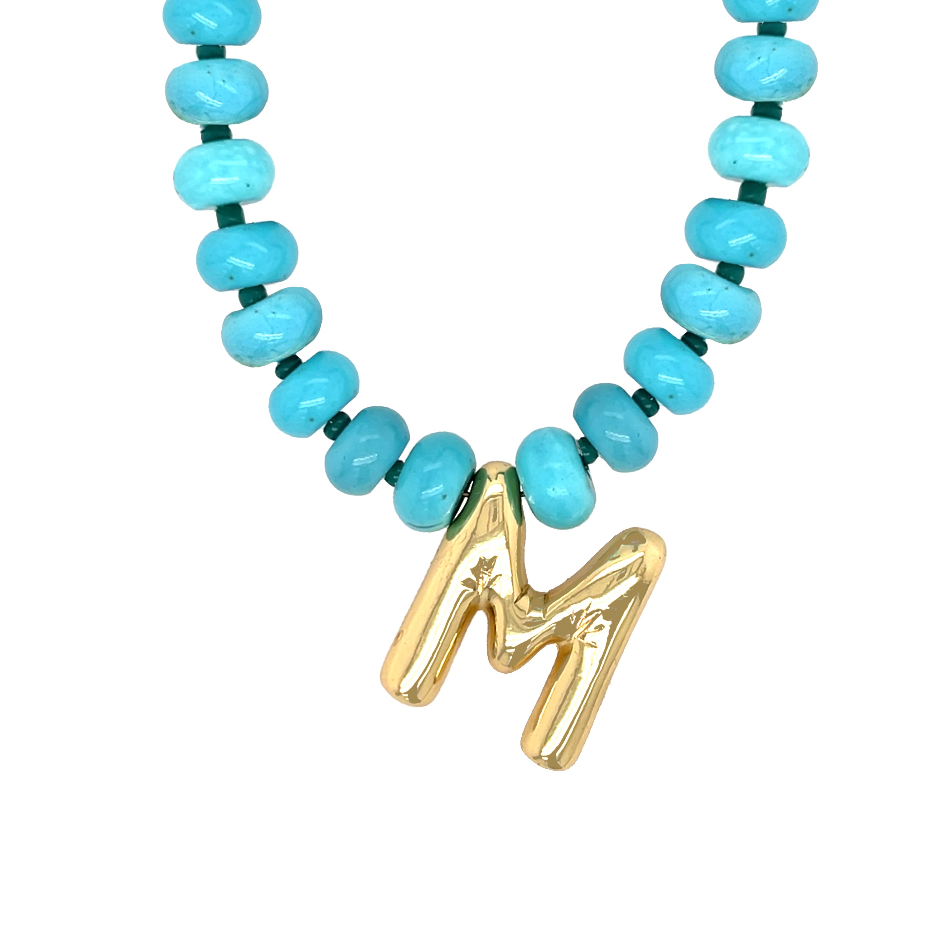 Necklace with turquoise beads and a gold 'M' pendant on a white background