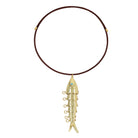 Gold fish-shaped pendant on a brown cord against a white background