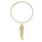 Gold necklace with a fish-shaped pendant on a white background