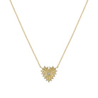Gold heart-shaped necklace with a central gemstone on a white background