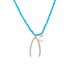 Wishbone & Pearl Charm Turquoise Beaded Necklace  Yellow Gold Plated Wishbone: 1.48" Long X 0.85" Wide Pearl: 0.46" Wide 15.5-18.5' Adjustable Length