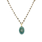 Aquamarine Oval Pendant, Blue Topaz Bezel, &amp; Labradorite Wire Chain Necklace

Curated for the jewelry lover who craves texture. This artisanal piece brings together a triad of powerful stones: the tranquil blue of Aquamarine, the sharp clarity of Blue Topaz, and the moody, iridescent depth of Labradorite beads. Wear it to add a sophisticated pop of color to a neutral knit, or layer it with shorter gold chains for a high-impact, tiered look.

Yellow Gold Plated
1.08" Long X 0.60" Wide
16-18" Adjustable L