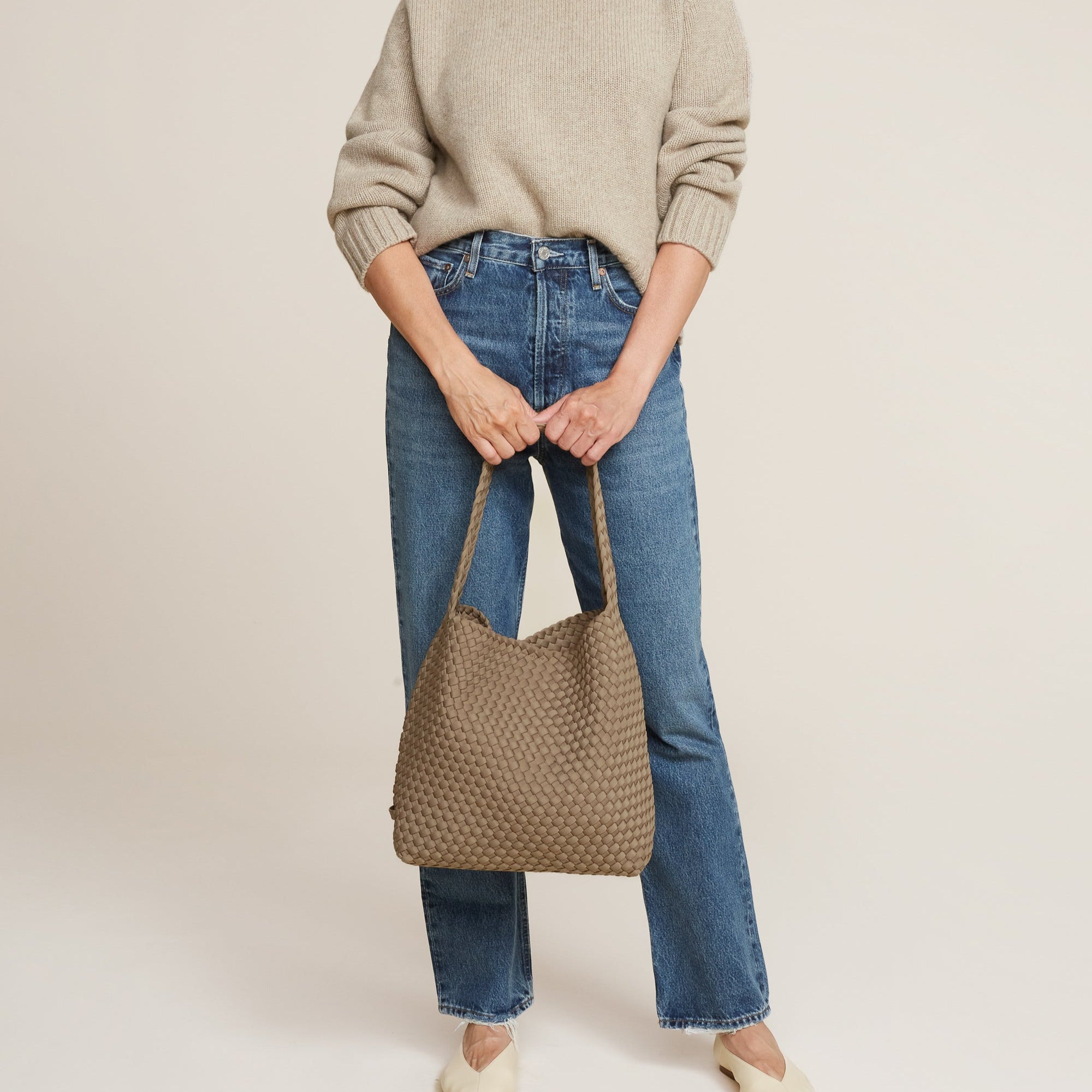 Cashmere Hobo Woven Bag

16" High X 12" Wide X 5” &nbsp;Deep
Strap Drop: 5"
Removable Pouch Included
Magnetic Snap Closure

Design by Naghedi