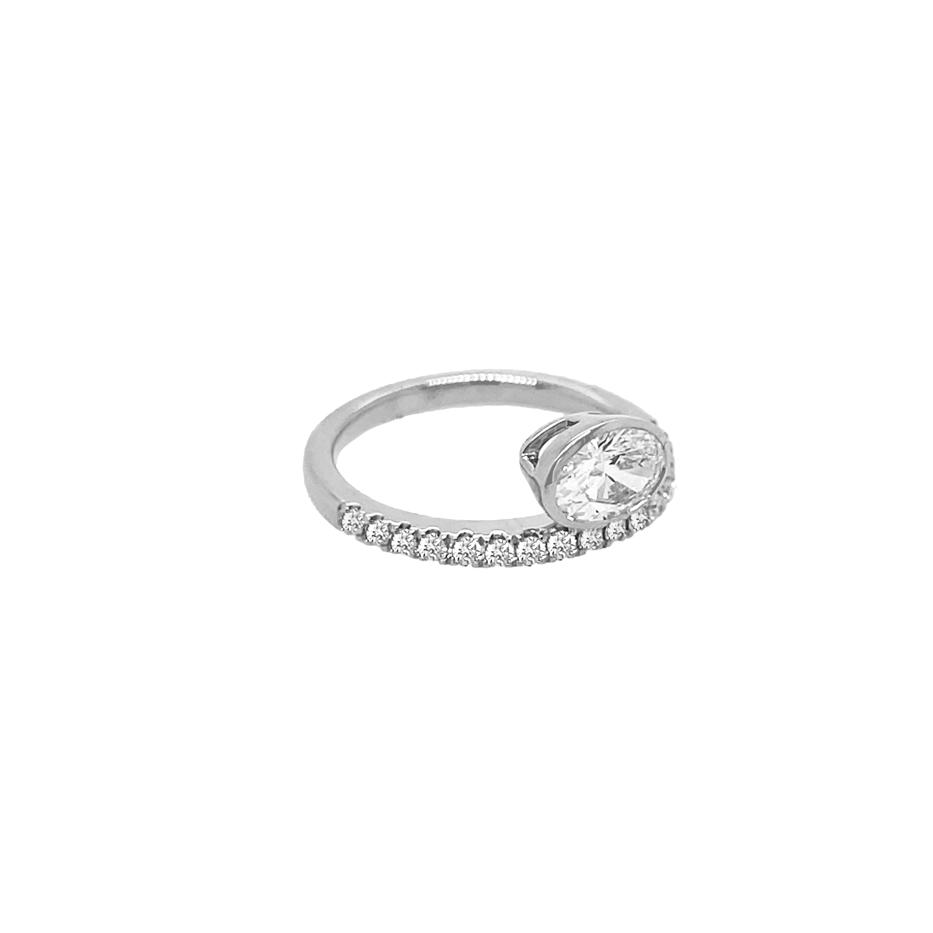 Silver ring with a diamond on a white background