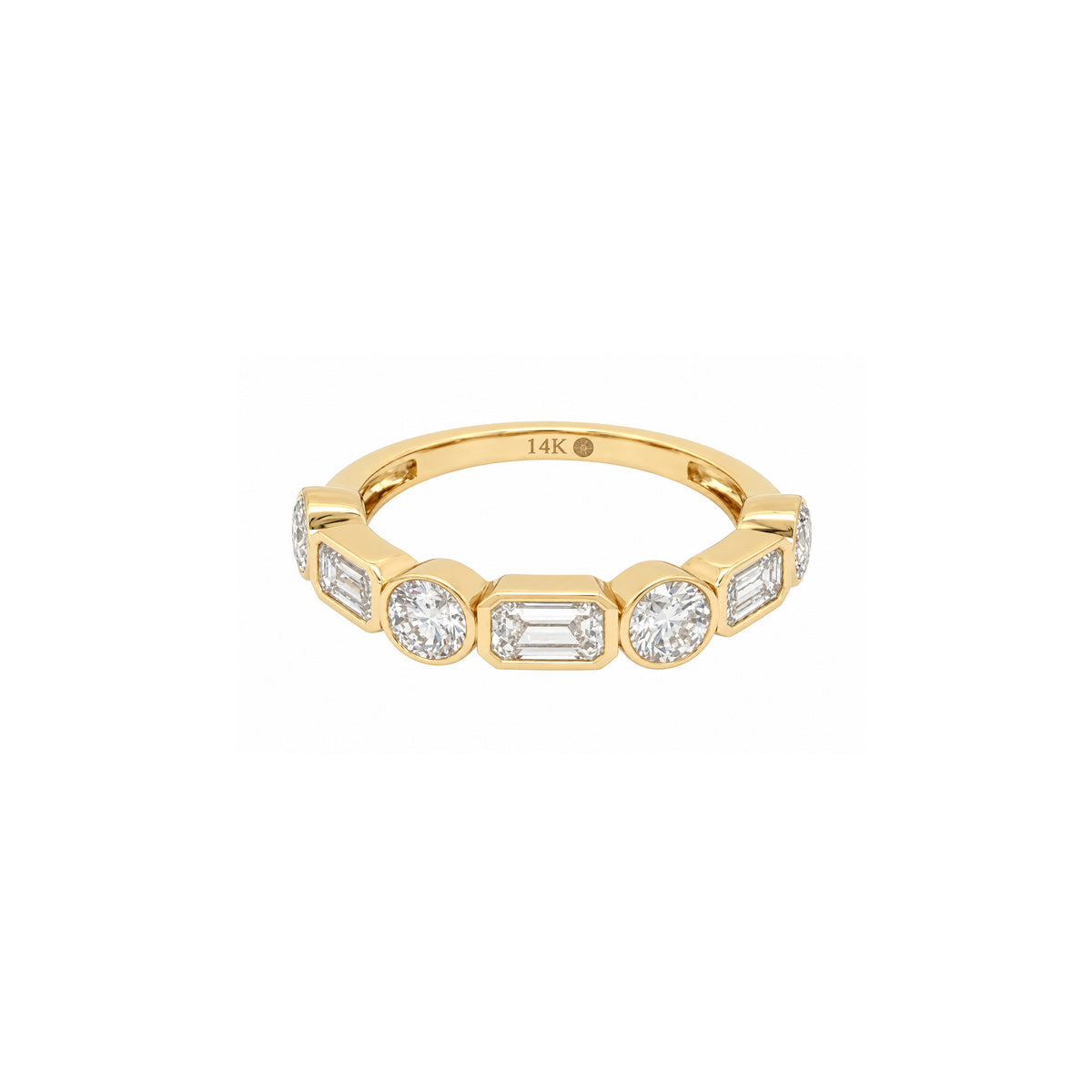 A yellow gold band ring featuring a row of baguette and round-cut clear stones