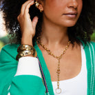 Link Toggle Lariat Necklace

Elevate your jewelry collection with this modern gold link toggle necklace, designed to make a bold yet versatile statement. This necklace features a chic Y-shaped silhouette accented by a toggle clasp closure and an oversized circular pendant drop. Its sleek design makes it perfect for layering with other chains or wearing solo for a polished, fashion-forward look.

Yellow Gold Plated
4" Drop
17" Long