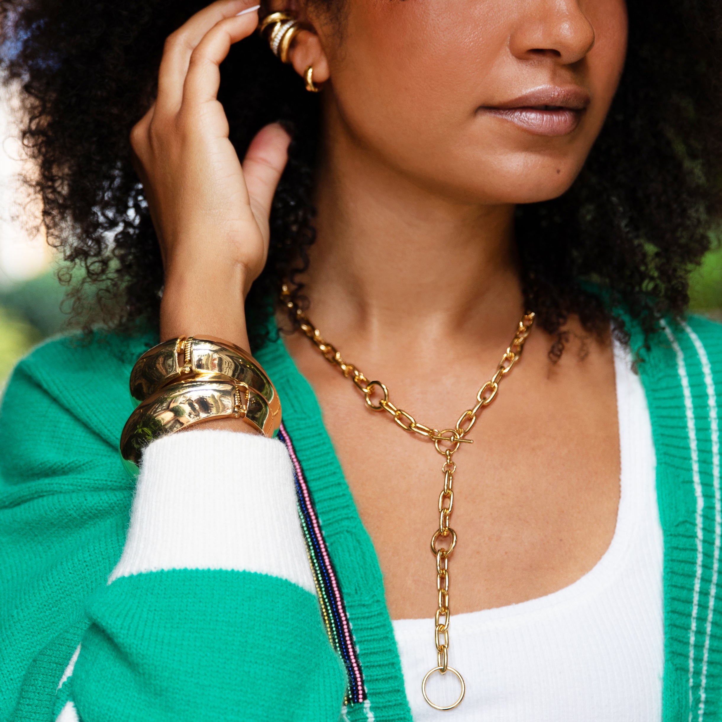 Link Toggle Lariat Necklace

Elevate your jewelry collection with this modern gold link toggle necklace, designed to make a bold yet versatile statement. This necklace features a chic Y-shaped silhouette accented by a toggle clasp closure and an oversized circular pendant drop. Its sleek design makes it perfect for layering with other chains or wearing solo for a polished, fashion-forward look.

Yellow Gold Plated
4" Drop
17" Long