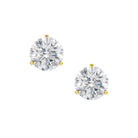 A pair of round-cut lab grown diamond stud earrings set in yellow gold prong settings on a solid white background.