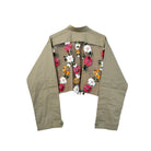 This jacket features intricate floral embroidery and shimmering sequins set against a breathable mesh back. Each piece is hand finished, ensuring no two are exactly alike. With its classic button down front and functional pockets, it offers a refined twist on vintage utility. It’s the perfect high-low balance: effortless enough for a white tee and denim, but polished enough to drape over a cocktail dress.